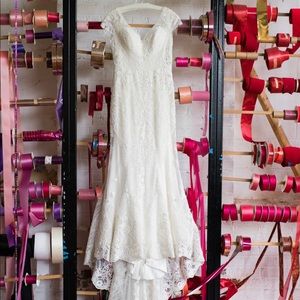 Stunning Casablanca Bridal gown.Beading throughout. Fits size 6-8 can be altered